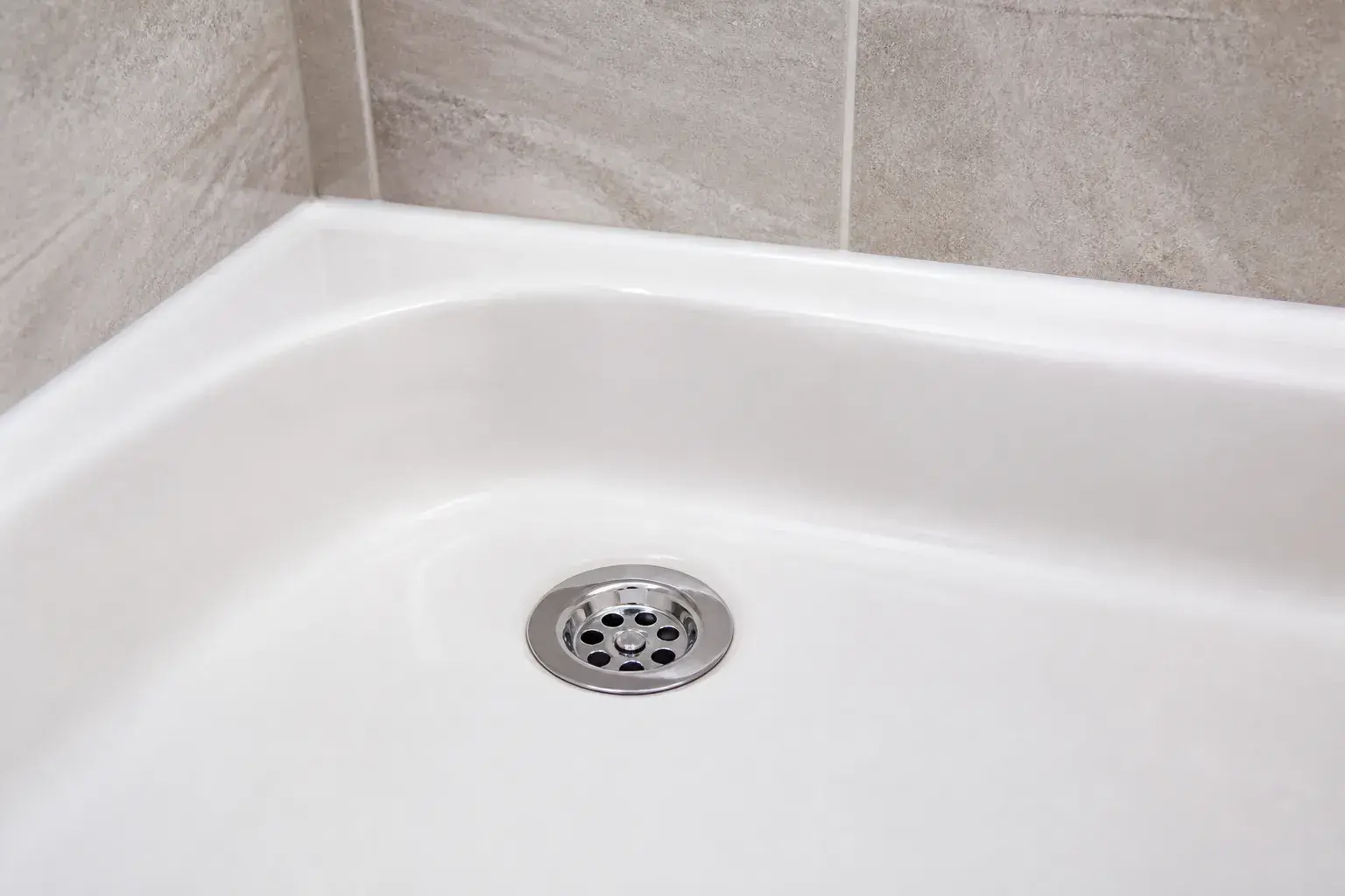 Clean bathtub drain and tile